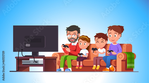 Family playing video game together sitting on sofa