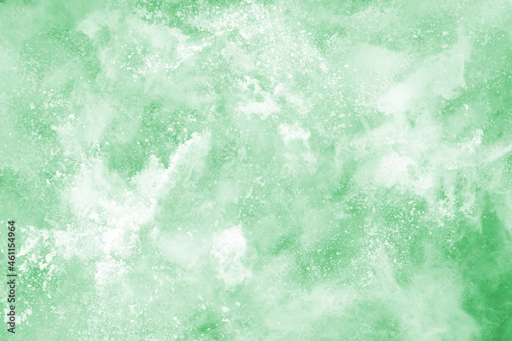 Fototapeta premium Green powder explosion on white background. Colored cloud. Colorful dust explode. Paint Holi.