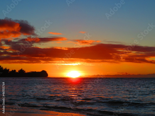 Beautiful sunset in Hawaii by ocean