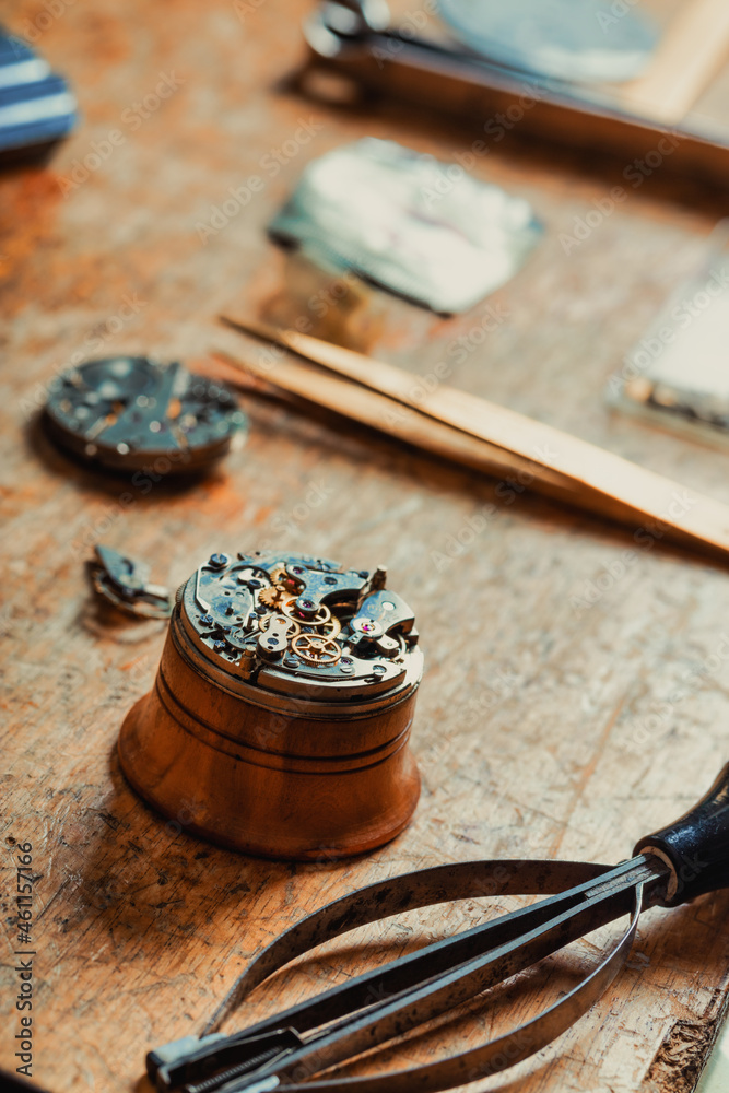 Selective focus to the dismantled mechanism of an old watch Selective focus to the dismantled mechanism of an old watch