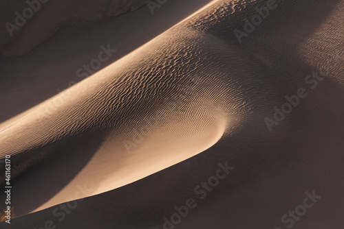 the formation of sands in dasht e lut or sahara desert with waved sand pattern on sand dune. Nature and landscapes of desert. Middle East desert