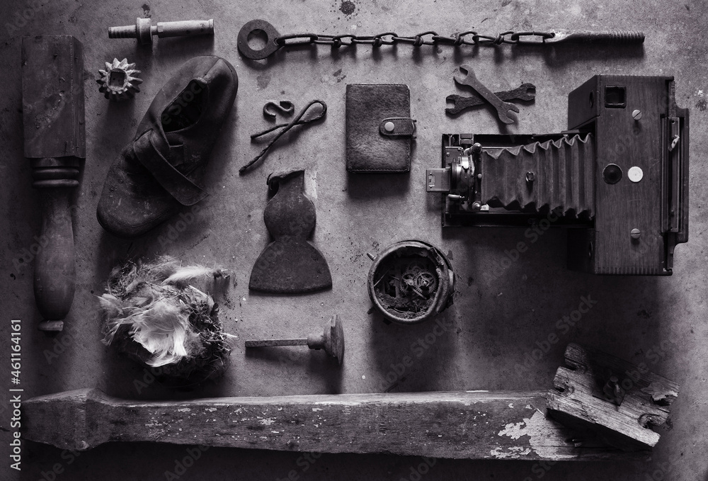 Still life of various found objects including a 1897 wooden camera