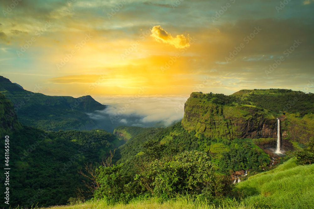 Beautiful waterfall with dramatic sky, somewhere in the Sahyadri ranges of western ghats of Maharashtra.