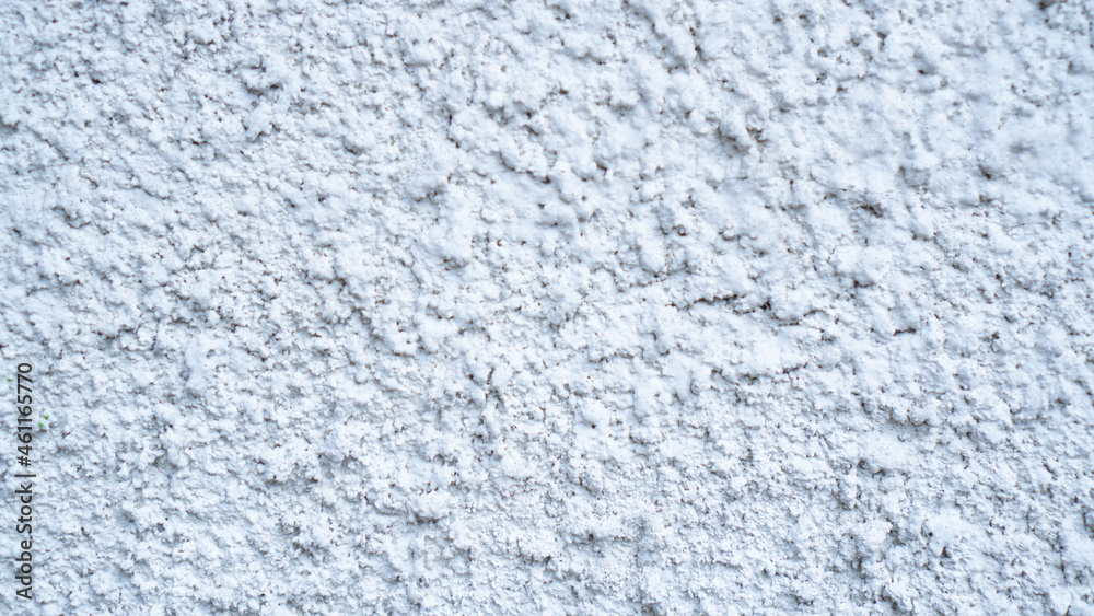 White external textured plaster. Structure of white cement plaster. Building facade background. Stucco wall White external textured plaster. Structure of white cement plaster. Building facade background. Stucco wall