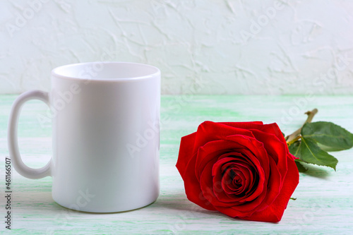 Fototapeta Naklejka Na Ścianę i Meble -  White coffee mug mockup with dark red rose