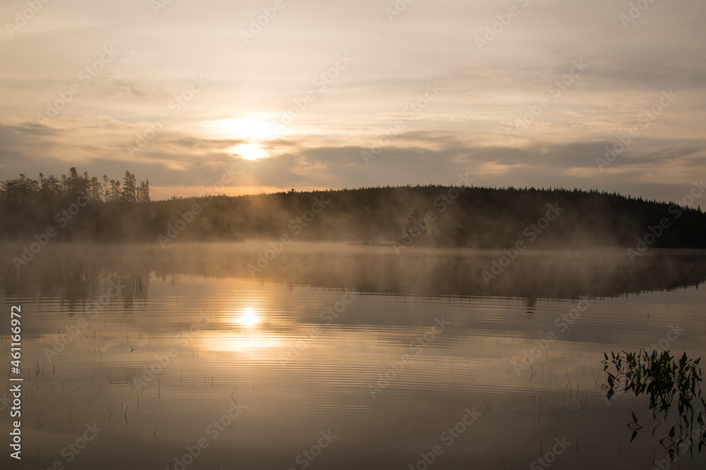 Fototapeta premium Calm lake with mist rising
