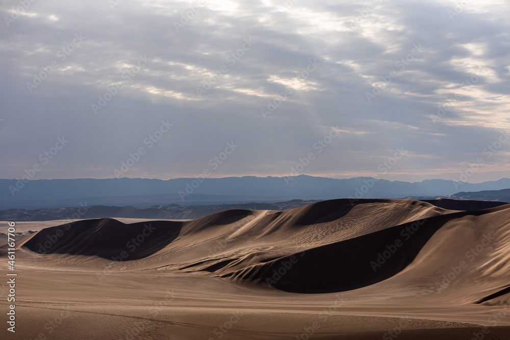 view from Nature and landscapes of dasht e lut or sahara desert after the rain with wet sand dunes and cloudy sky. Middle East desert