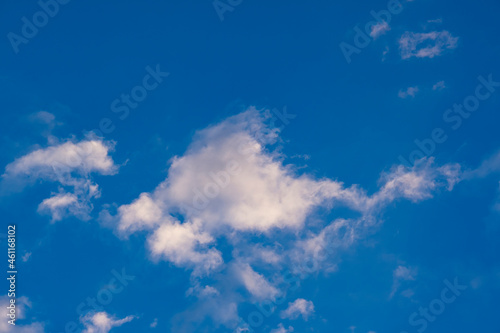 Blue sky with clouds at sunrise. Morning sky background