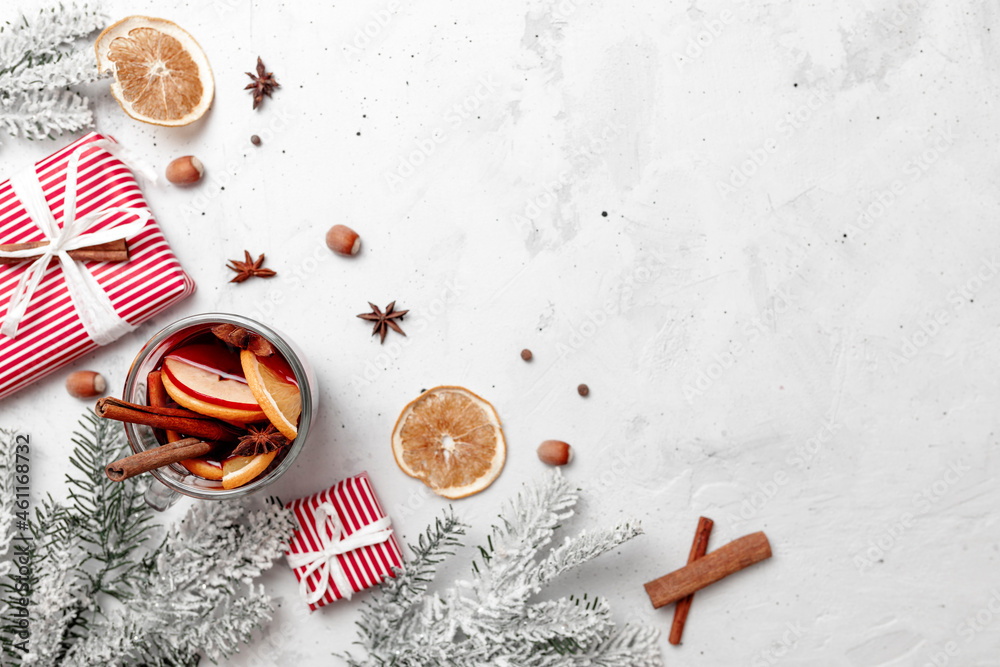 Christmas flat lay top view with glass cup of Mulled Wine, gift box, decorations Christmas flat lay top view with glass cup of Mulled Wine, gift box, decorations