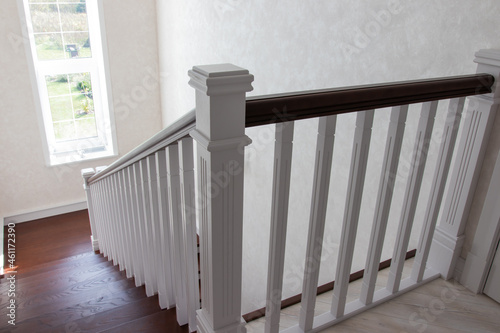 wooden staircase with brown treads and white risers
