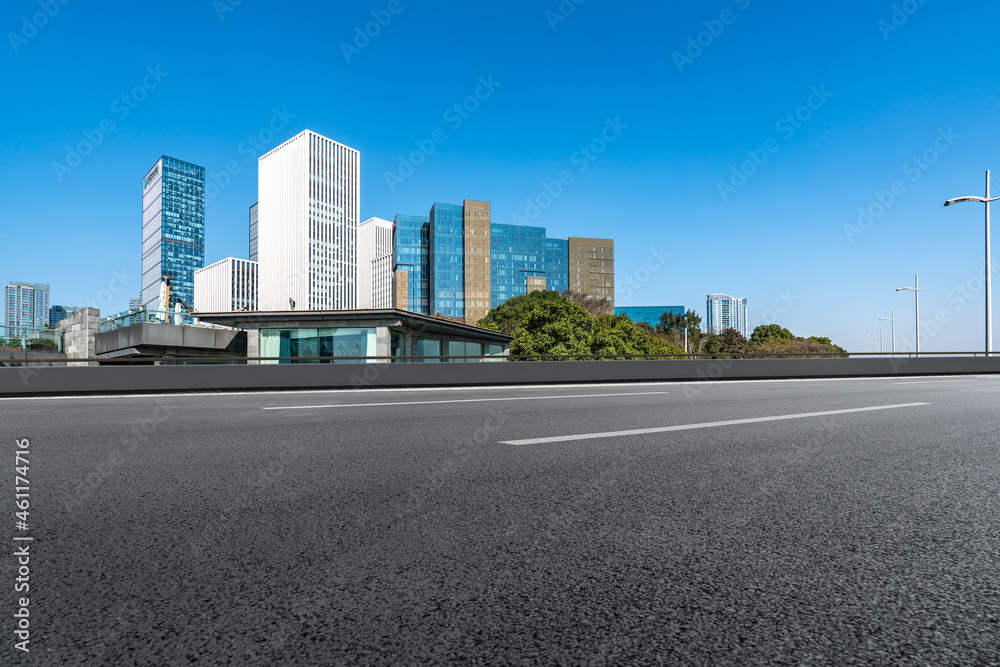 Empty asphalt road and city skyline and building landscape, China. Empty asphalt road and city skyline and building landscape, China.