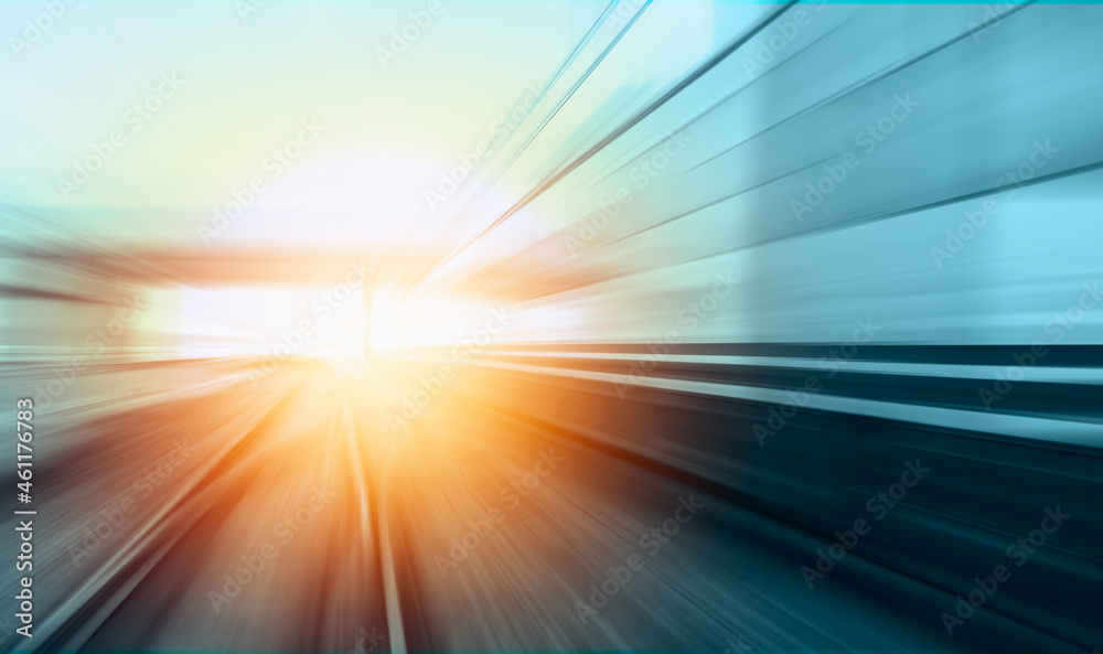 White high speed train runs on rail tracks -Train in motion White high speed train runs on rail tracks -Train in motion