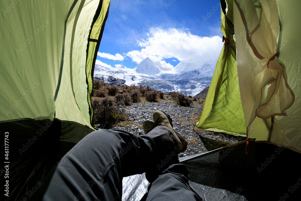 Fototapeta premium Hiker enjoy the beautiful landscape in tent