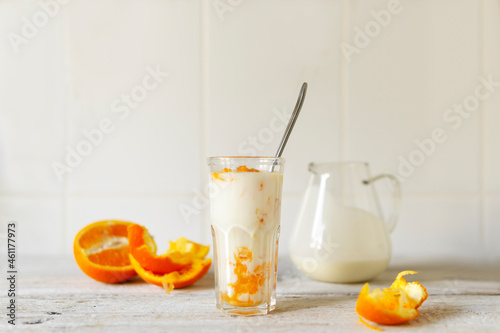 Natural yoghurt with fresh orange. Breakfast
