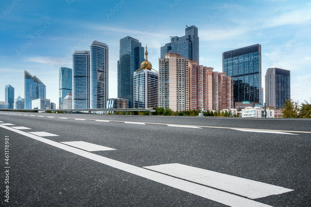 Empty asphalt road and city skyline and building landscape, China. Empty asphalt road and city skyline and building landscape, China.