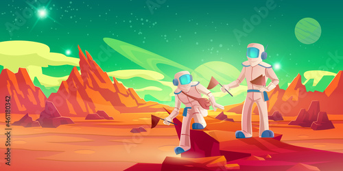 Spacemen with flags walking on Mars surface. Vector cartoon illustration of alien planet landscape with red ground and mountains, stars in sky and astronauts in spacesuits photo