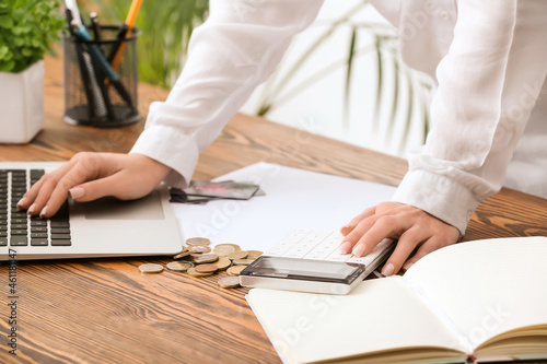Businesswoman with calculat...