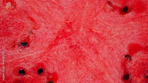Background texture of fresh red ripe juicy watermelon. A large and useful berry. Rotation.
