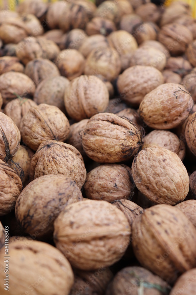close up of walnuts on wooden background close up of walnuts on wooden background