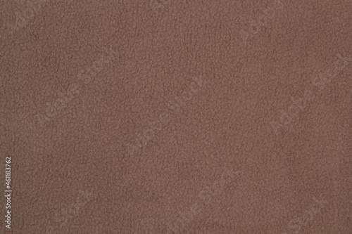 Fleece fabric brown top view. Texture of textile fleece bedspread.	 photo