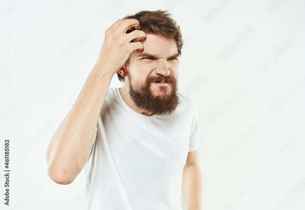 Man in a white t-shirt expressive look discontent Lifestyle Man in a white t-shirt expressive look discontent Lifestyle