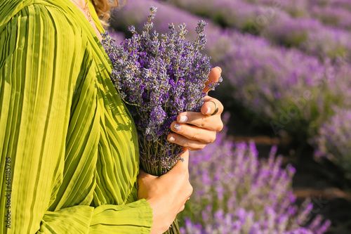 Fototapeta Naklejka Na Ścianę i Meble -  Beautiful young woman in lavender field, closeup