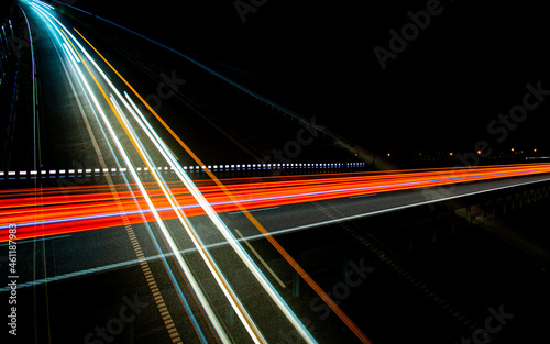 Night road lights. Lights of moving cars at night. long exposure red, blue, green