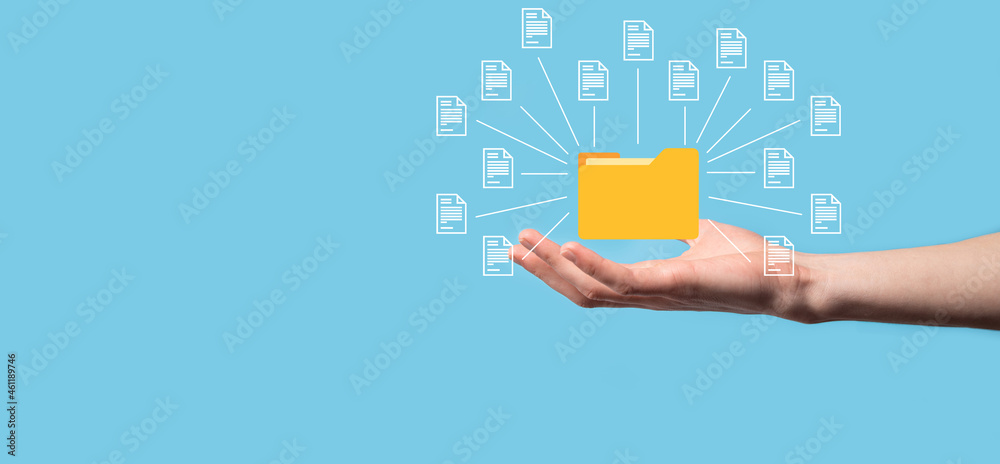 Document Management System DMS .Businessman hold folder and document icon.Software for archiving, searching and managing corporate files and information.Internet Technology Concept.Digital security. Document Management System DMS .Businessman hold folder and document icon.Software for archiving, searching and managing corporate files and information.Internet Technology Concept.Digital security.