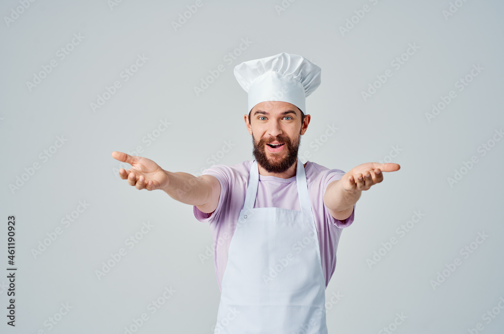 a bearded man in a chef's uniform gestures with his hands the emotions of professionals a bearded man in a chef's uniform gestures with his hands the emotions of professionals