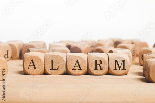 Alarm Word Written In Wooden Cube