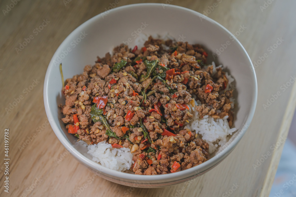 Stir fried pork with basil on topped boiled rice is popular thai style street food. Stir fried pork with basil on topped boiled rice is popular thai style street food.