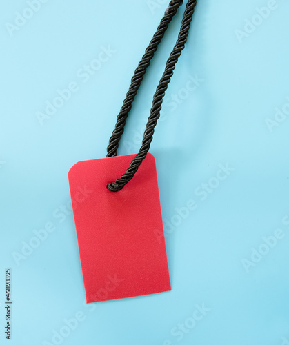 red tag or price label over blue background. promo, discount or sale concept, space for text, promo or ad. 