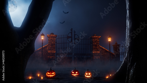 Halloween Illuminated pumpkins with Candles, at an Eerie Forest Churchyard Gate at Night. photo