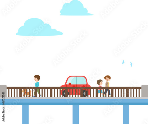 町の橋を渡る人物と自動車