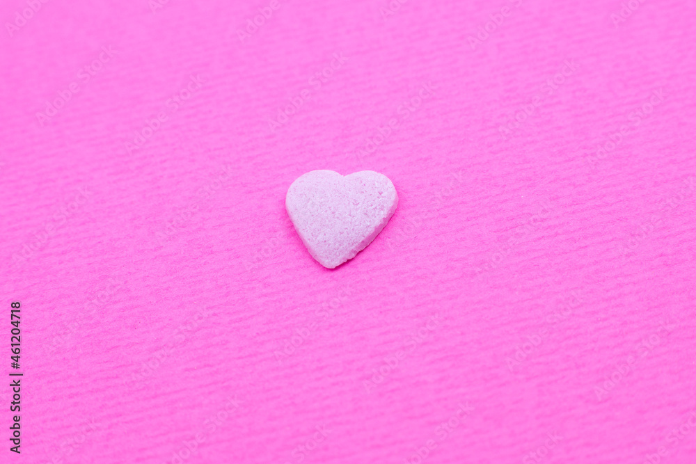 Pink heart on pink background. Saint Valentine's day concept. Love and romantic photo. Postcard for holiday. Beautiful warm wallpaper with love. Soft focus. Copy space.