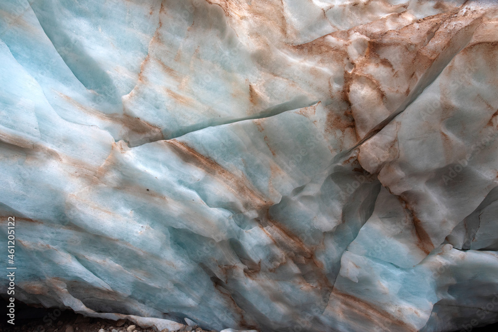 the texture of the blue ice of a mountain glacier