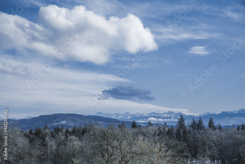beautiful blue scenery of the mountains after sunset in the swiss alps