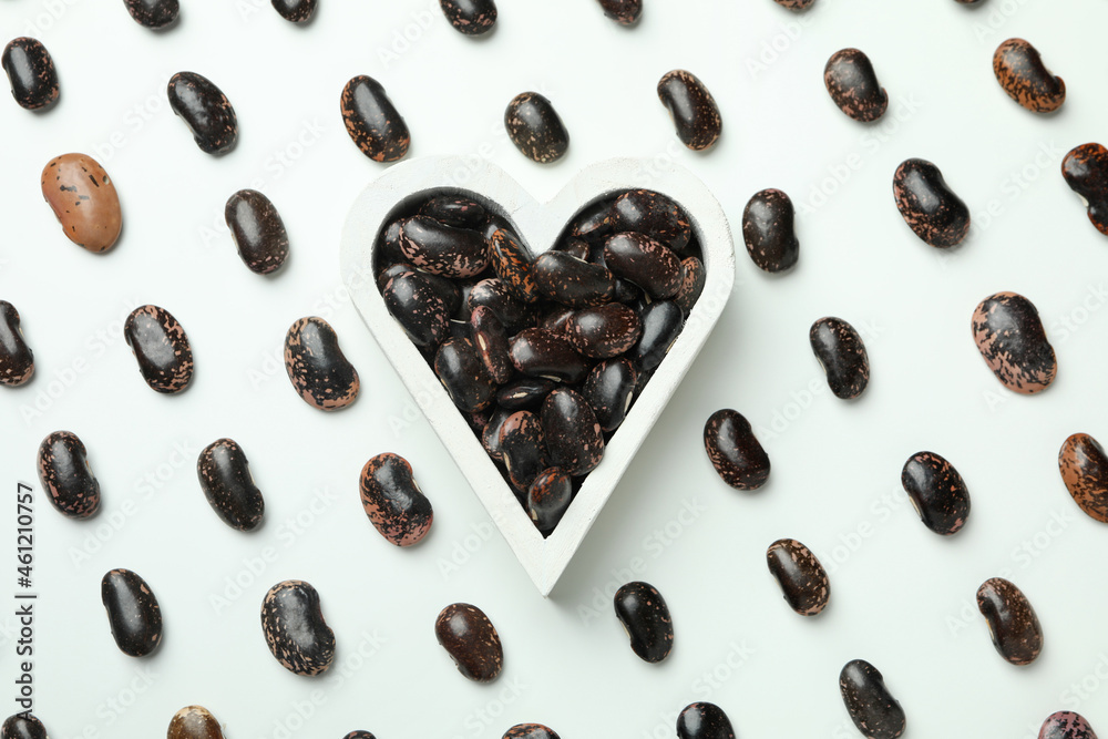 Flat lay composition with beans and heart with beans on white background Flat lay composition with beans and heart with beans on white background