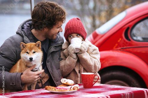 Caring father travel with small kid daughter have sneak outside car on winter holidays. Child and single dad spend Christmas weekend or vacation together enjoy family relaxation outdoor. Love and care