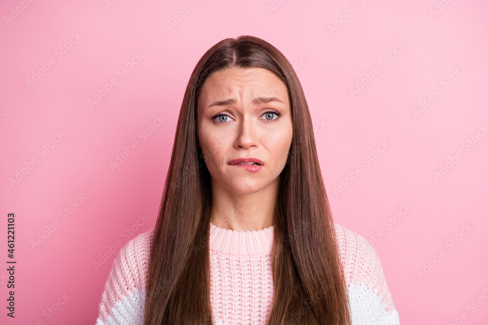 Photo portrait of guilty sad woman biting lip nervous unhappy isolated on pastel pink color background - obrazy, fototapety, plakaty 