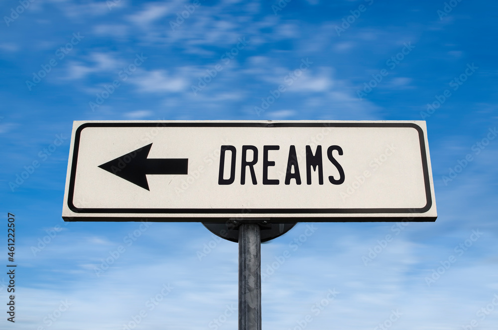 Dreams road sign, arrow on blue sky background. One way blank road sign with copy space. Arrow on a pole pointing in one direction.
