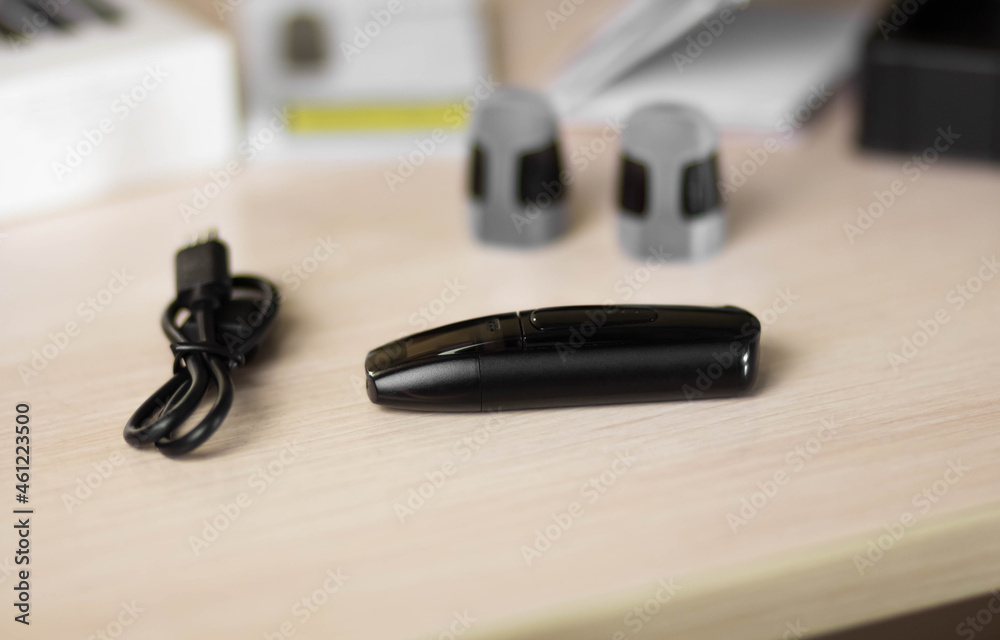 Black electronic cigarette. Electronic nicotine delivery system Black electronic cigarette. Electronic nicotine delivery system