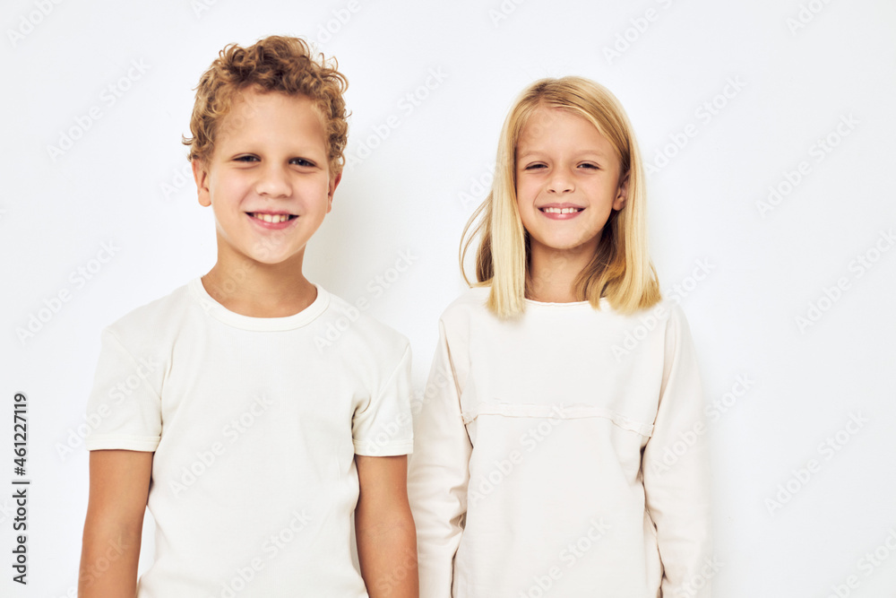 Two preschool children boy and girl smile posing casual wear isolated background Two preschool children boy and girl smile posing casual wear isolated background