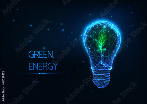 Abstract green energy concept with glowing low polygonal lightbulb and green sprout on dark blue