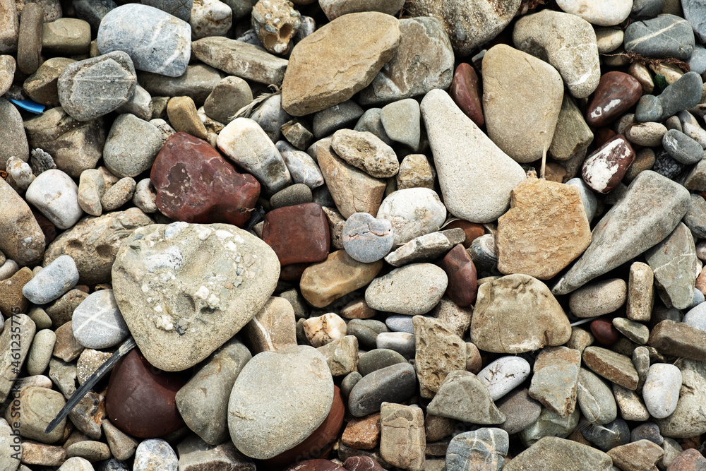 Stones of different shapes and colors background, top view. Stones of different shapes and colors background, top view.