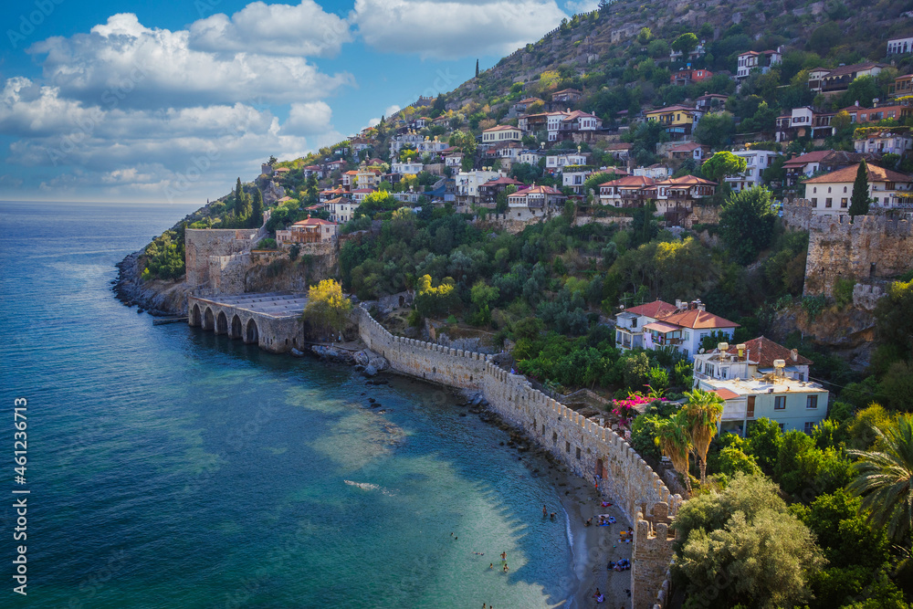 Alanya castle in Turkey with the sea bay and old harbor and lighthouse
