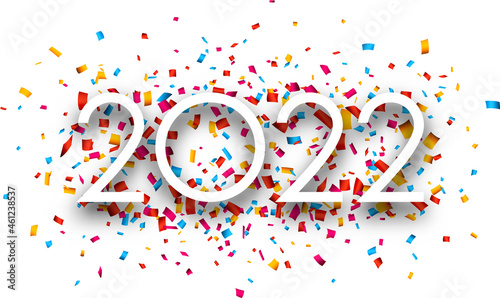 2022 white sign over colourful confetti.