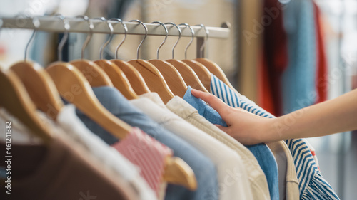 Close Up Shot of Clothing Rack with Colorful Stylish Items. Shopping Center Interior. Modern Fashionable Shop, Clothes for Every Taste. Fashionable Design, Quality Sustainable Materials. No People.