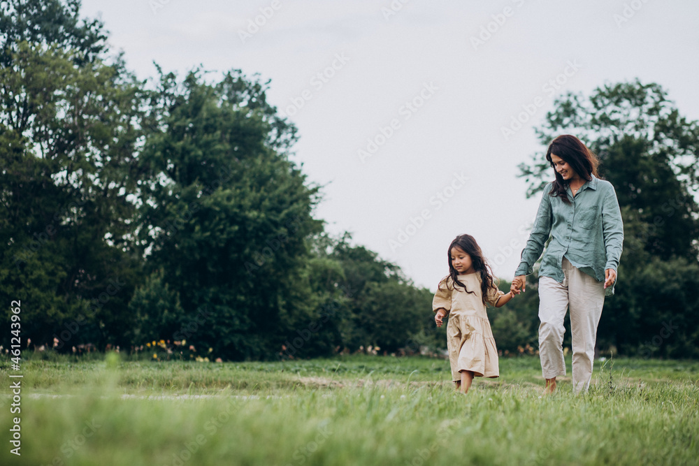 Obraz premium Mother with her daughter having fun together in park