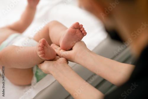 Certified physiotherapist performing a neonatal neurological assessment photo